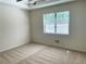 A well-lit bedroom features carpet and a window at 1028 Gate Post Ln, Lawrenceville, GA 30044