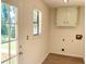 Convenient laundry room features natural light and easy access to the outdoors at 1028 Gate Post Ln, Lawrenceville, GA 30044