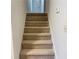 Carpeted stairs lead to the upper level at 1028 Gate Post Ln, Lawrenceville, GA 30044