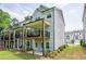 Townhome exterior showing balconies, outdoor seating, and a landscaped lawn area at 3518 Mount Blue Ave, Tucker, GA 30084