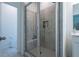 Modern bathroom features a large glass shower with gray tiling and built-in shelving at 3518 Mount Blue Ave, Tucker, GA 30084