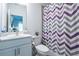 Tidy full bathroom with chevron shower curtain, modern toilet, and sink with cabinet at 3518 Mount Blue Ave, Tucker, GA 30084