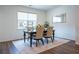 Cozy dining area with hardwood floors, rug, and window providing natural light at 3518 Mount Blue Ave, Tucker, GA 30084