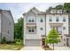 Charming townhome featuring neutral paint, attached garage, and manicured lawn at 3518 Mount Blue Ave, Tucker, GA 30084
