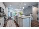 Stylish kitchen showcasing granite counters, white cabinetry, and stainless appliances at 3518 Mount Blue Ave, Tucker, GA 30084