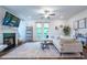 Bright living room with fireplace, french doors, and open layout at 3518 Mount Blue Ave, Tucker, GA 30084