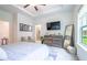 Spacious main bedroom with tray ceiling, wall decor and carpeted floors at 3518 Mount Blue Ave, Tucker, GA 30084