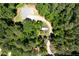 Aerial view of home with circular driveway surrounded by dense trees at 390 Rock Springs Pass, Dallas, GA 30157