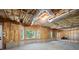 Unfinished basement ready for customization with exposed framing and natural light at 390 Rock Springs Pass, Dallas, GA 30157