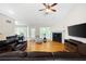Spacious living room with hardwood floors, a fireplace, vaulted ceilings, and plenty of natural light at 390 Rock Springs Pass, Dallas, GA 30157