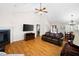 Inviting living area featuring a cozy fireplace, hardwood floors, and an open layout for entertaining at 390 Rock Springs Pass, Dallas, GA 30157
