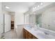 Bathroom showcasing dual sinks, a large mirror, and a separate shower at 390 Rock Springs Pass, Dallas, GA 30157