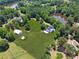 Lush property with ponds and green pastures and a home with a long driveway at 471 Henderson Lake Dr, Canton, GA 30115