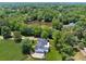 Panoramic aerial view of the property, featuring a house, serene pond and lush greenery at 471 Henderson Lake Dr, Canton, GA 30115