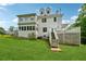 Rear view of the home with multiple decks, staircases, and a well-maintained lawn at 471 Henderson Lake Dr, Canton, GA 30115