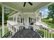 Elevated back porch with seating area overlooks the backyard, providing a peaceful outdoor retreat at 471 Henderson Lake Dr, Canton, GA 30115
