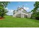 Spacious backyard view featuring a manicured lawn, gazebo, and mature trees at 471 Henderson Lake Dr, Canton, GA 30115