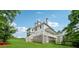 Beautiful backyard featuring a large deck, gazebo, and well-maintained lawn at 471 Henderson Lake Dr, Canton, GA 30115