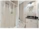 Clean bathroom featuring a shower, toilet, vanity and mirror at 471 Henderson Lake Dr, Canton, GA 30115