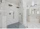 Bright white bathroom features a glass shower with dual shower heads, and a soaking tub at 471 Henderson Lake Dr, Canton, GA 30115