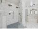 Beautiful, bright bathroom features dual shower heads, marble floors, and glass shower at 471 Henderson Lake Dr, Canton, GA 30115