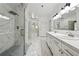 Luxurious bathroom featuring marble tile, glass shower, and double sink vanity with great lighting at 471 Henderson Lake Dr, Canton, GA 30115