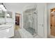 Contemporary bathroom featuring double sinks, a glass enclosed shower, and two closets at 471 Henderson Lake Dr, Canton, GA 30115