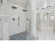 A bright, elegant bathroom with a dual shower, glass enclosure, and marble tiling at 471 Henderson Lake Dr, Canton, GA 30115