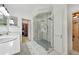 Beautiful bright bathroom features double vanity, glass shower, and walk-in closet access at 471 Henderson Lake Dr, Canton, GA 30115