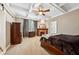 Comfortable bedroom featuring a decorative ceiling, fireplace, and a wood sliding barn door at 471 Henderson Lake Dr, Canton, GA 30115