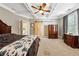 Inviting bedroom with coffered ceiling, dresser, and a sliding barn door at 471 Henderson Lake Dr, Canton, GA 30115