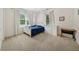 Neutral bedroom features carpet, two windows with blinds, closet, desk and dresser at 471 Henderson Lake Dr, Canton, GA 30115