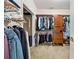 Walk-in closet with hanging racks, wooden drawers, and storage space at 471 Henderson Lake Dr, Canton, GA 30115