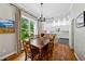 Cozy dining area with natural light and a view to the backyard through a large window at 471 Henderson Lake Dr, Canton, GA 30115
