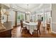 Formal dining room with hardwood floors, natural light, and stylish chandelier, ideal for hosting gatherings at 471 Henderson Lake Dr, Canton, GA 30115