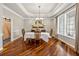 Formal dining room featuring hardwood floors and modern decor, and a wood sliding barn door at 471 Henderson Lake Dr, Canton, GA 30115