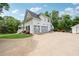 Charming two-story home with a three-car garage, lovely landscaping, and inviting front porch at 471 Henderson Lake Dr, Canton, GA 30115