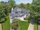 Stunning two-story home with a white exterior, black shutters, and a welcoming front porch at 471 Henderson Lake Dr, Canton, GA 30115