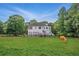 Sprawling property featuring a well-maintained home, a large yard, and mature trees at 471 Henderson Lake Dr, Canton, GA 30115