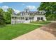 Beautiful two-story home with a charming front porch and well-maintained lawn and landscaping at 471 Henderson Lake Dr, Canton, GA 30115