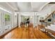 Elegant foyer featuring hardwood floors, a piano, and staircase, offering a warm welcome to the home at 471 Henderson Lake Dr, Canton, GA 30115
