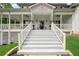 Inviting front entrance featuring elegant stairs leading to a covered porch with decorative details at 471 Henderson Lake Dr, Canton, GA 30115