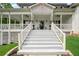 Inviting front entrance with grand steps, a covered porch, and decorative planters at 471 Henderson Lake Dr, Canton, GA 30115