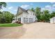 Charming two-story home with a three-car garage, mature trees and well manicured lawn at 471 Henderson Lake Dr, Canton, GA 30115
