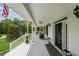 Spacious covered front porch with comfortable seating, ideal for outdoor relaxation at 471 Henderson Lake Dr, Canton, GA 30115