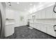 Bright kitchen featuring white cabinets, stainless steel appliances, and stone flooring at 471 Henderson Lake Dr, Canton, GA 30115