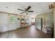 Cozy living area with wood-look tile flooring, neutral walls, and a view to the outdoors at 471 Henderson Lake Dr, Canton, GA 30115