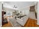 Spacious living room featuring hardwood floors, fireplace, and staircase at 471 Henderson Lake Dr, Canton, GA 30115