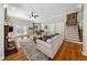 Open living room with hardwood floors, fireplace, and stairway to the second floor at 471 Henderson Lake Dr, Canton, GA 30115