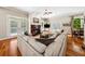 Cozy living room featuring a fireplace, hardwood floors, and ample seating, perfect for relaxation and gatherings at 471 Henderson Lake Dr, Canton, GA 30115